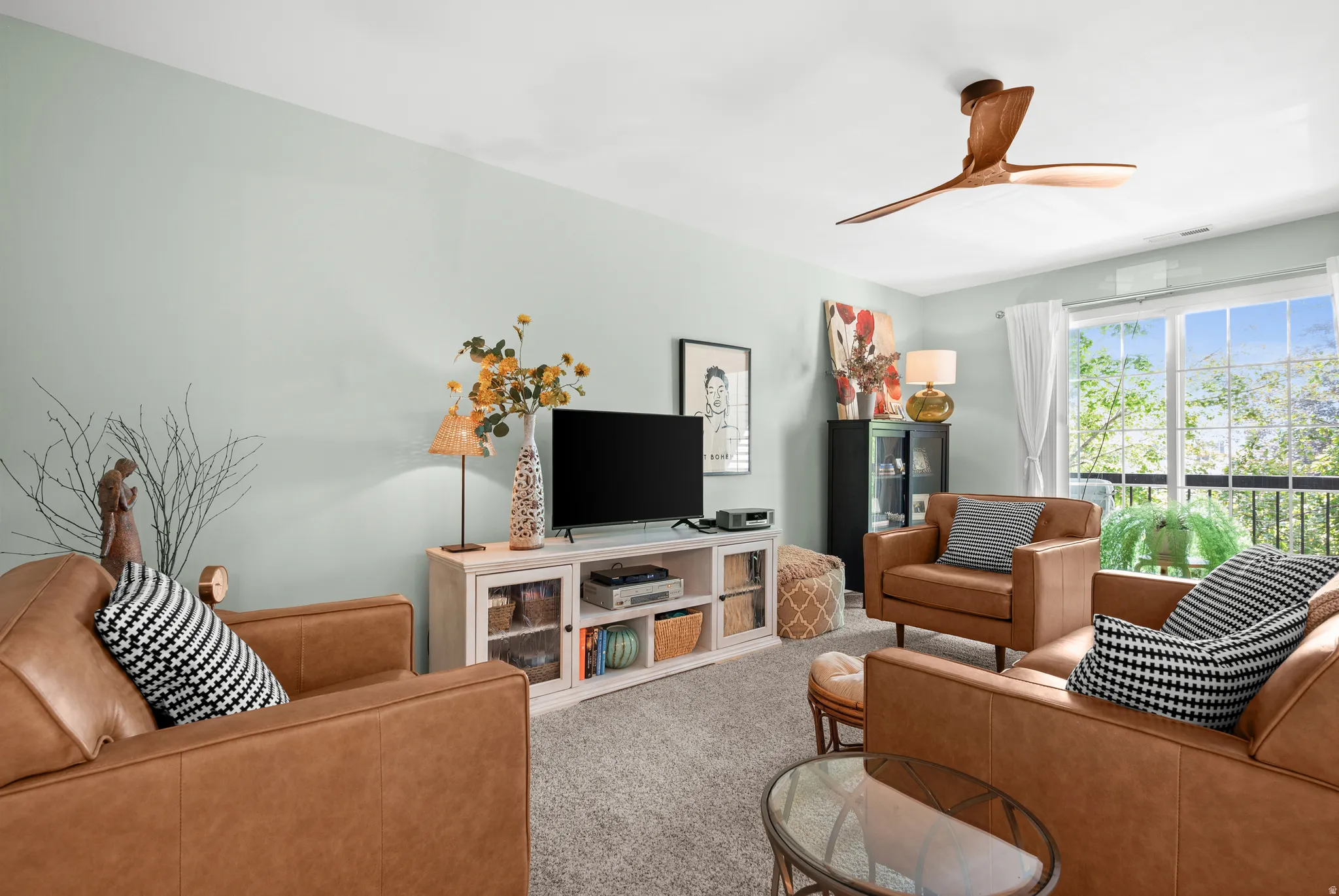Recessed lighting, wood-finish ceiling fan, and light-toned wall color
