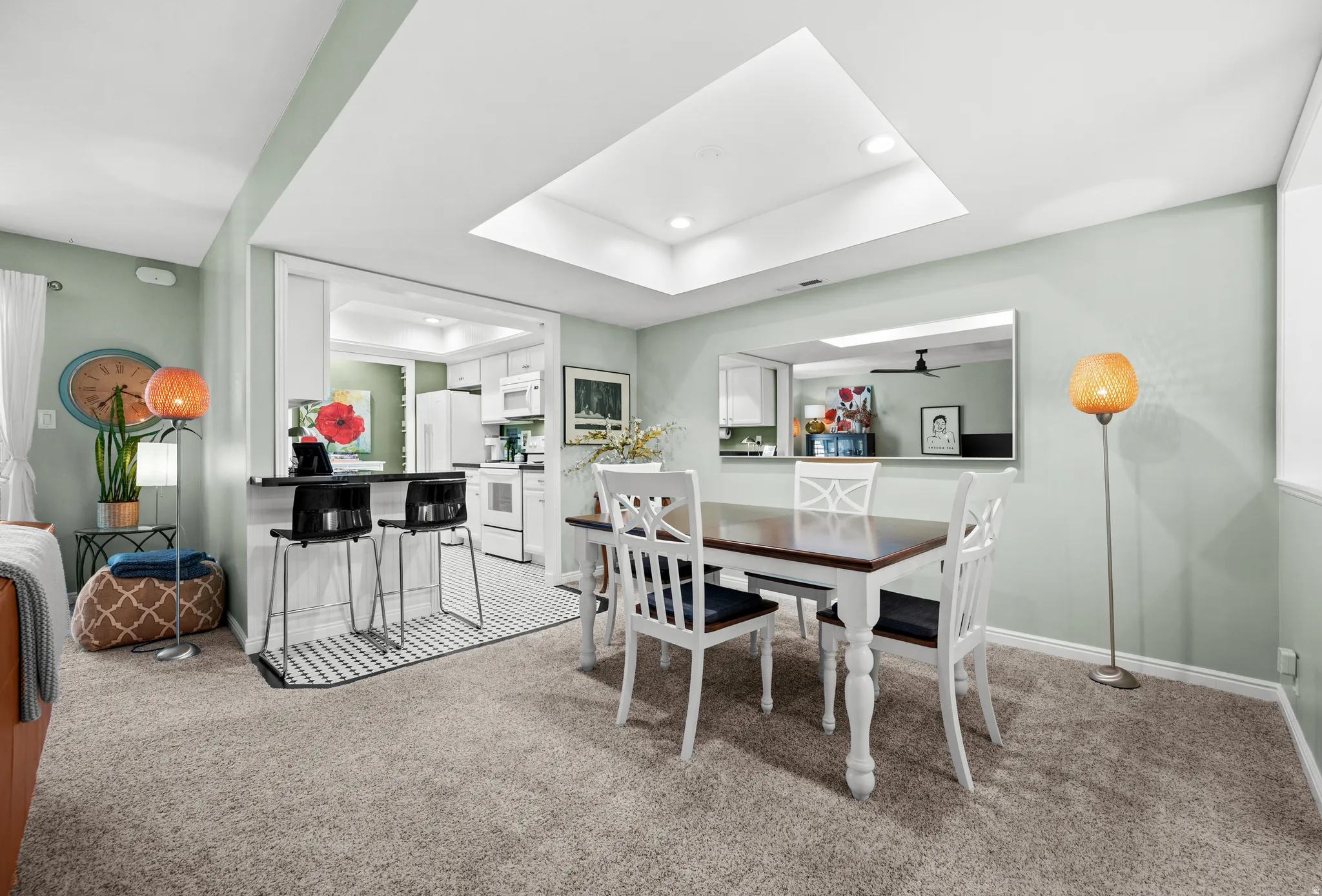 Recessed ceiling light with a skylight-style frame, light-toned wall paint, and carpeted flooring