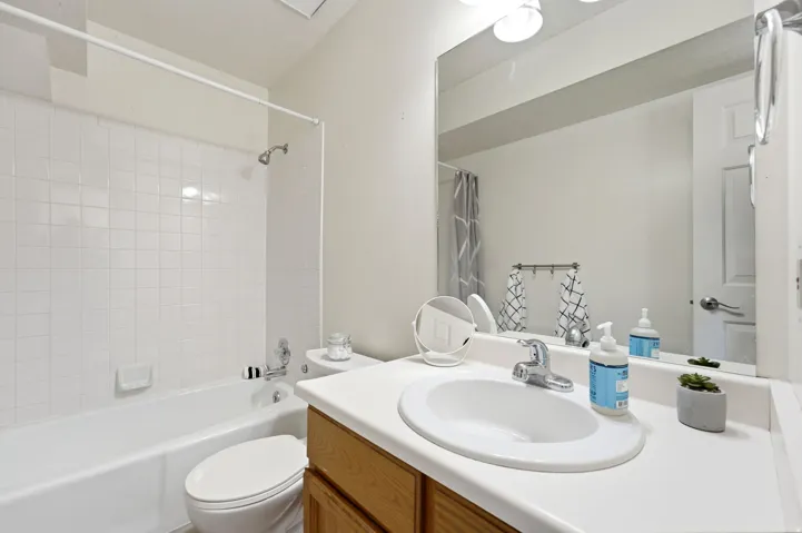White tile shower and tub combination
