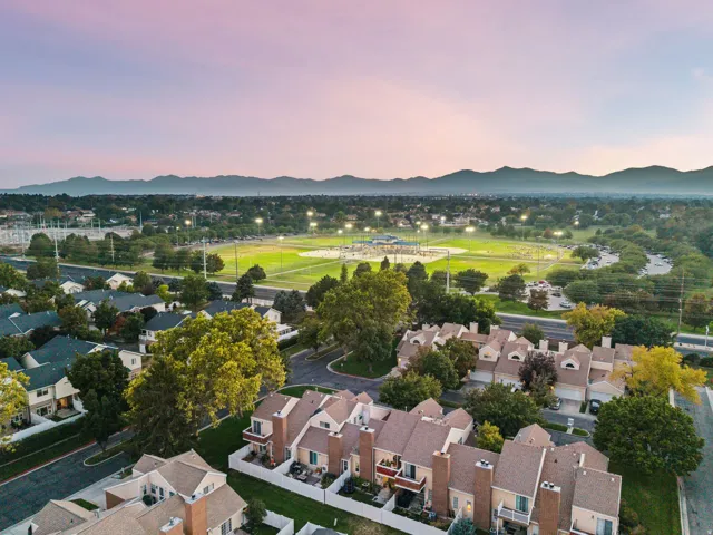 Townhome community with mountain scenery, mature trees, and nearby sports fields