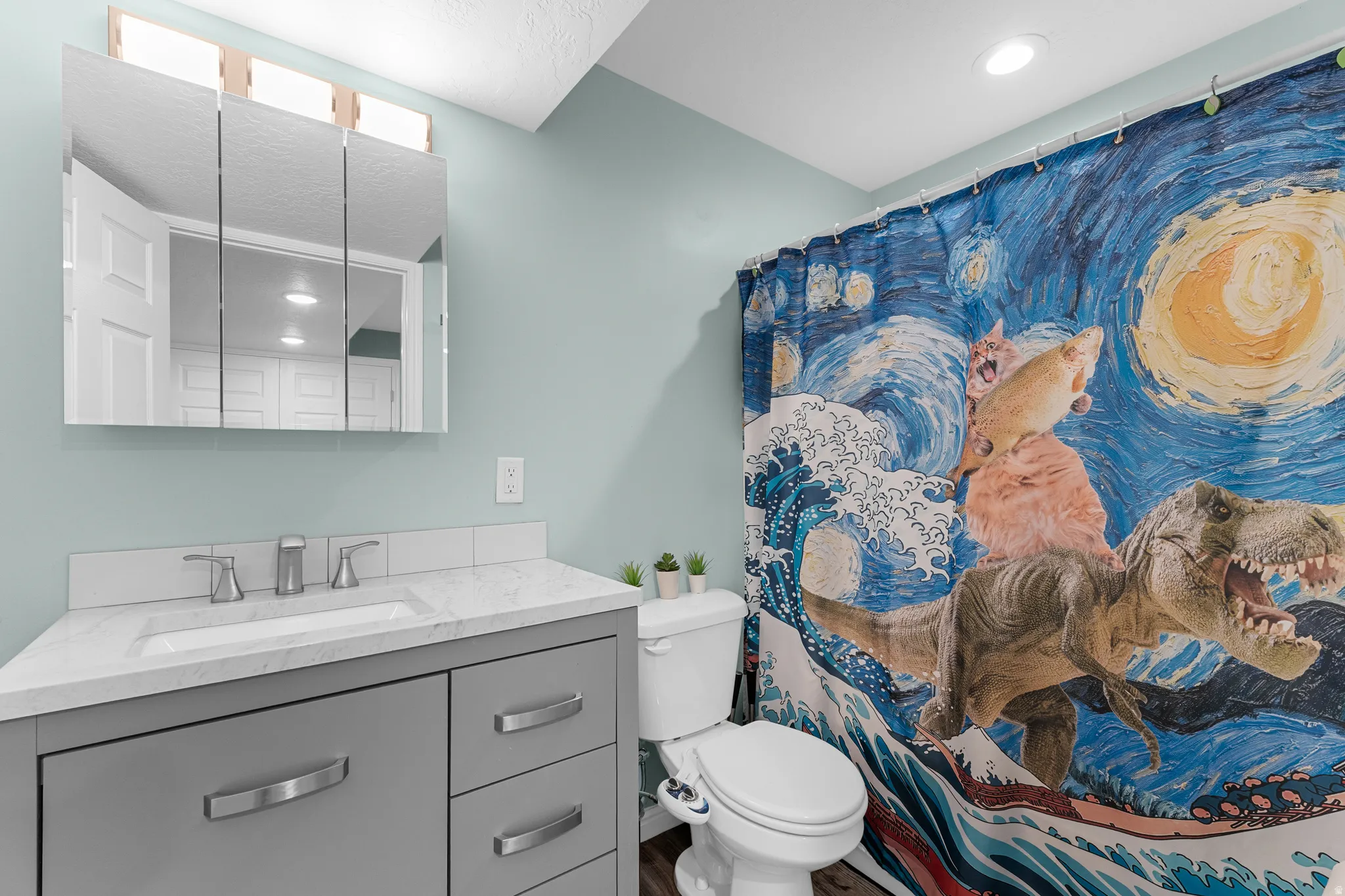 Corner vanity with a white countertop and rectangular sink