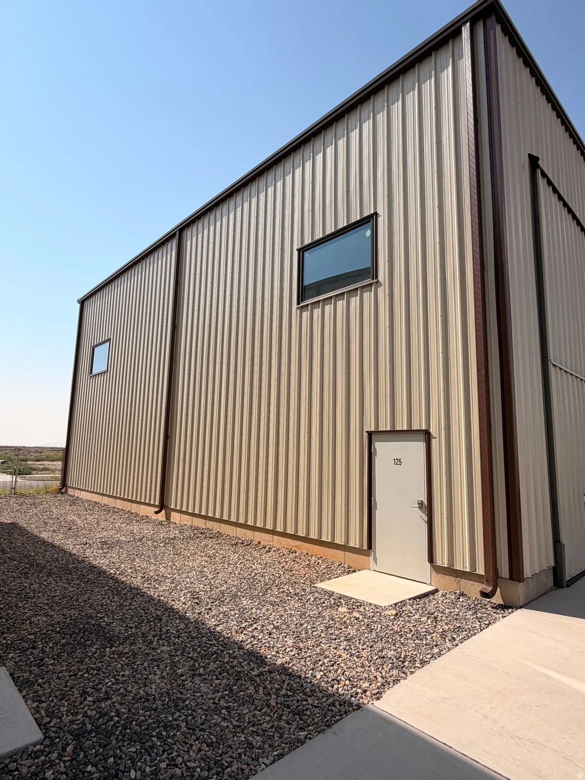 Metal-clad exterior with corrugated panels