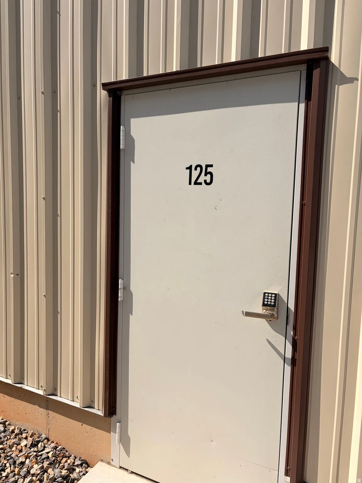 Corrugated metal siding in a light neutral tone