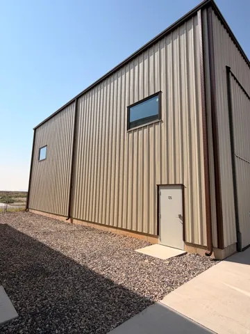 Metal-clad exterior with corrugated panels