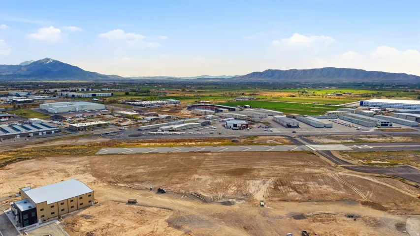 Expansive undeveloped land with a mountain backdrop