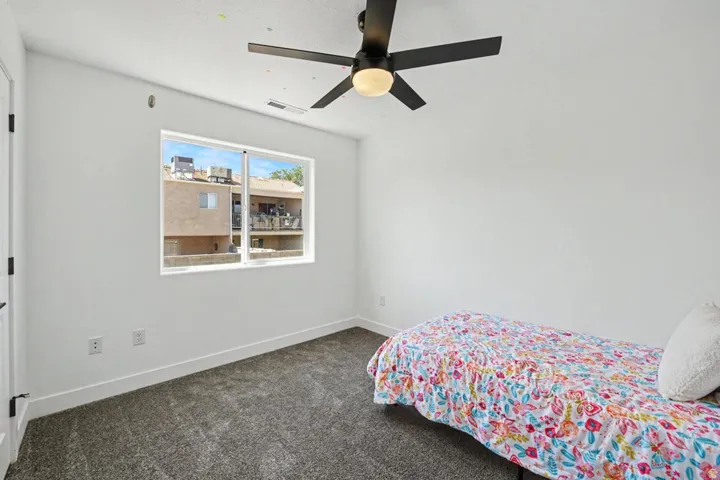 White walls with dark gray carpeting