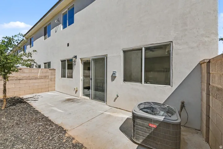 Concrete patio area with a stucco exterior