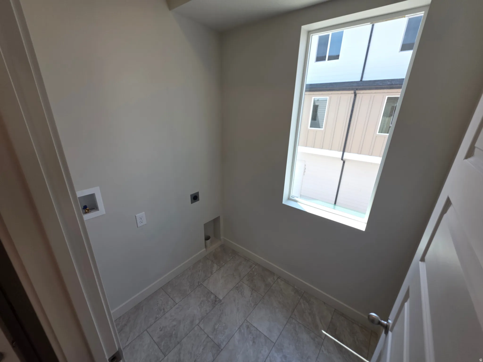 Wall-mounted window, tile flooring, and light gray wall paint