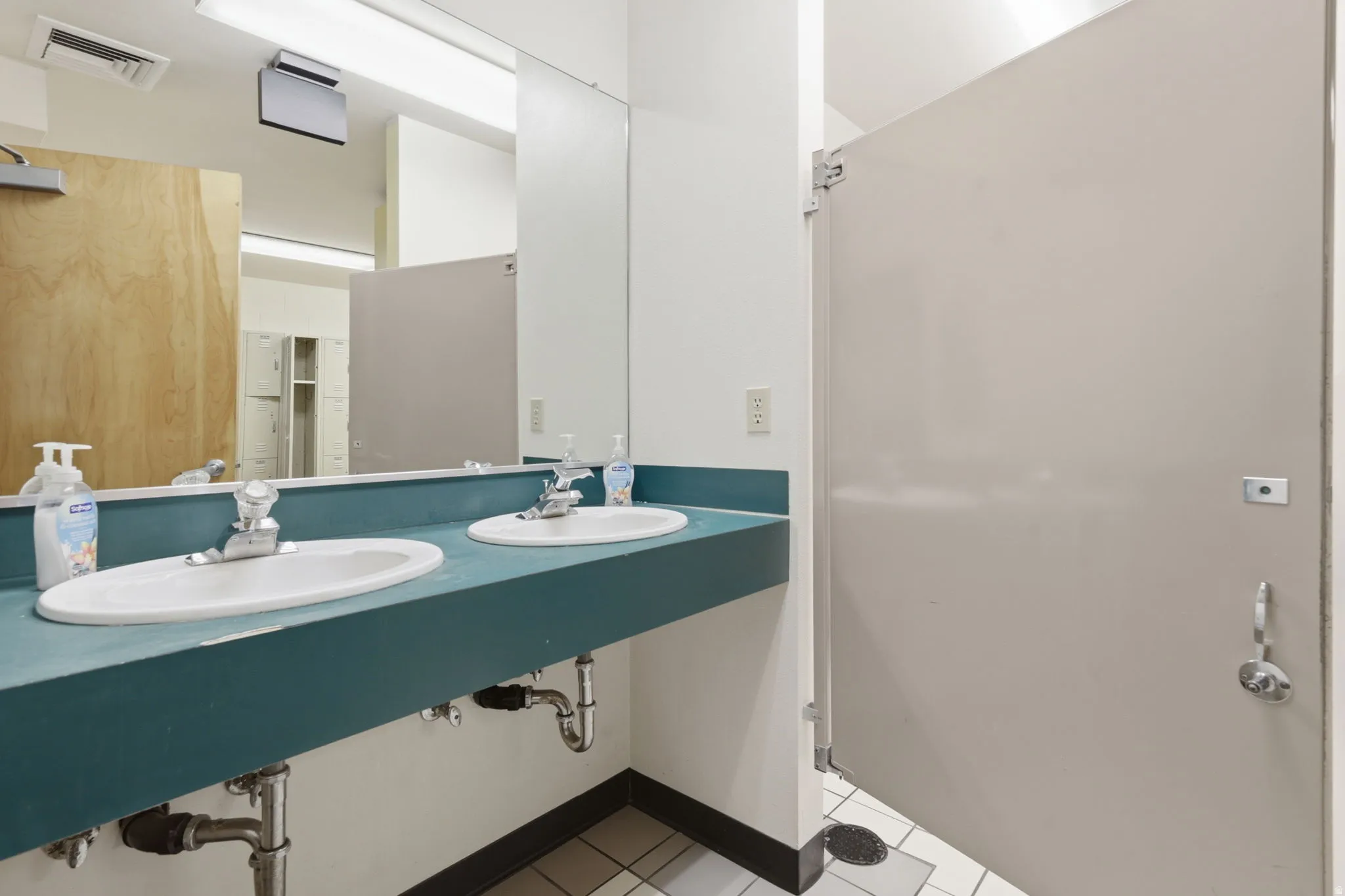 Double vanity featuring two oval sinks and chrome fixtures