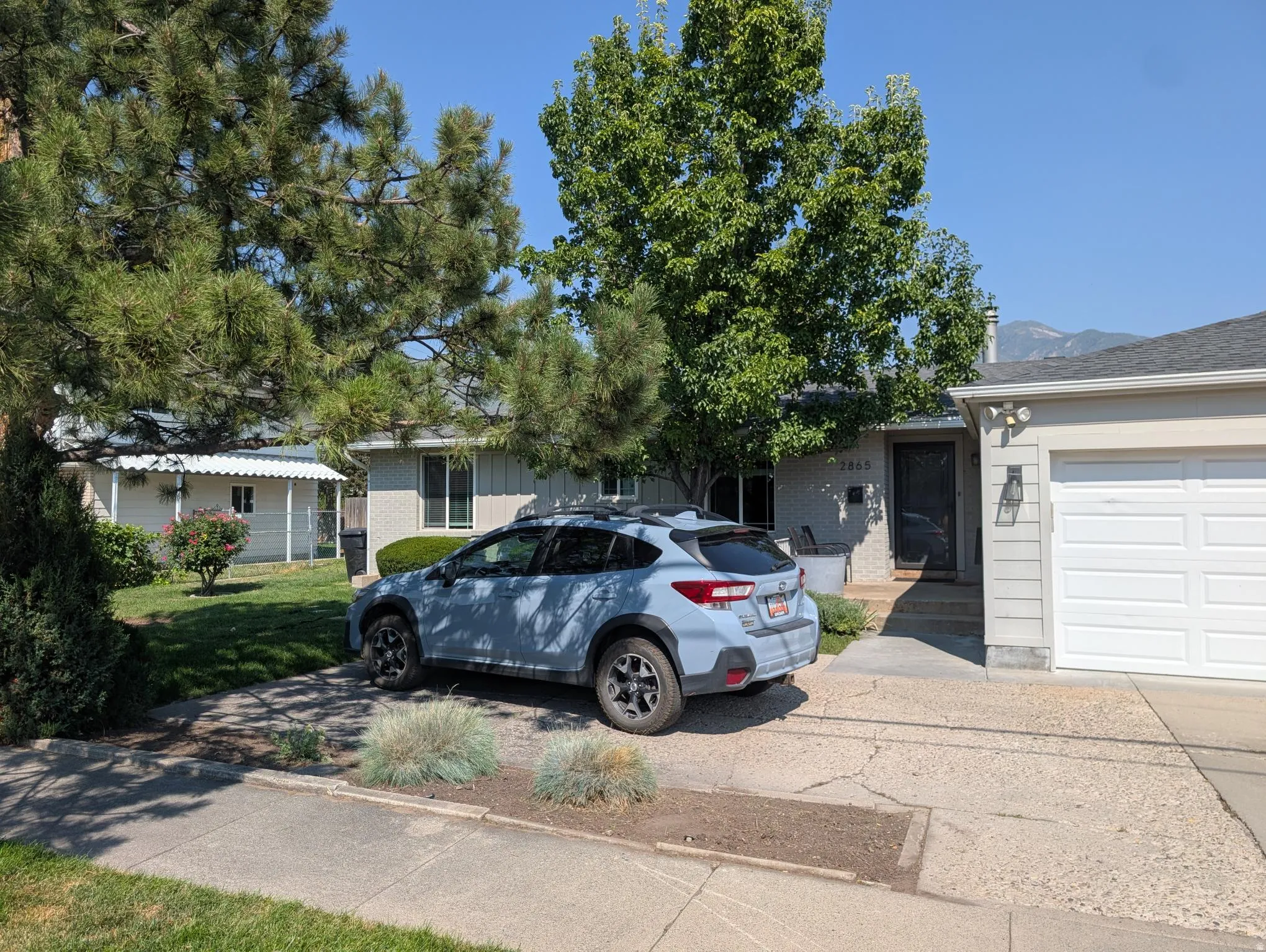 White two-car garage with a horizontal panel door
