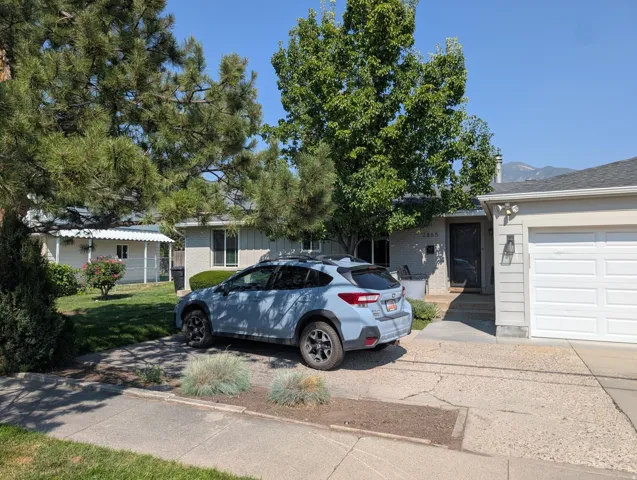 White two-car garage with a horizontal panel door