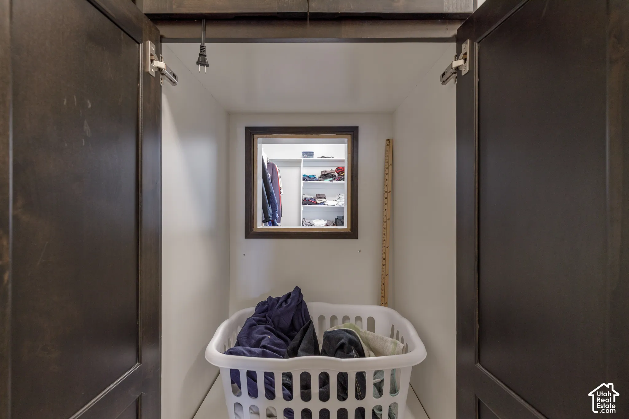 Built-in storage niche with a dark wood-finish frame