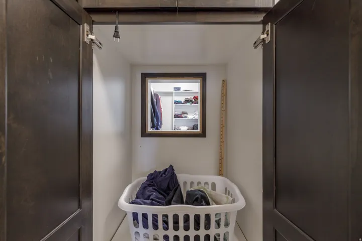 Built-in storage niche with a dark wood-finish frame