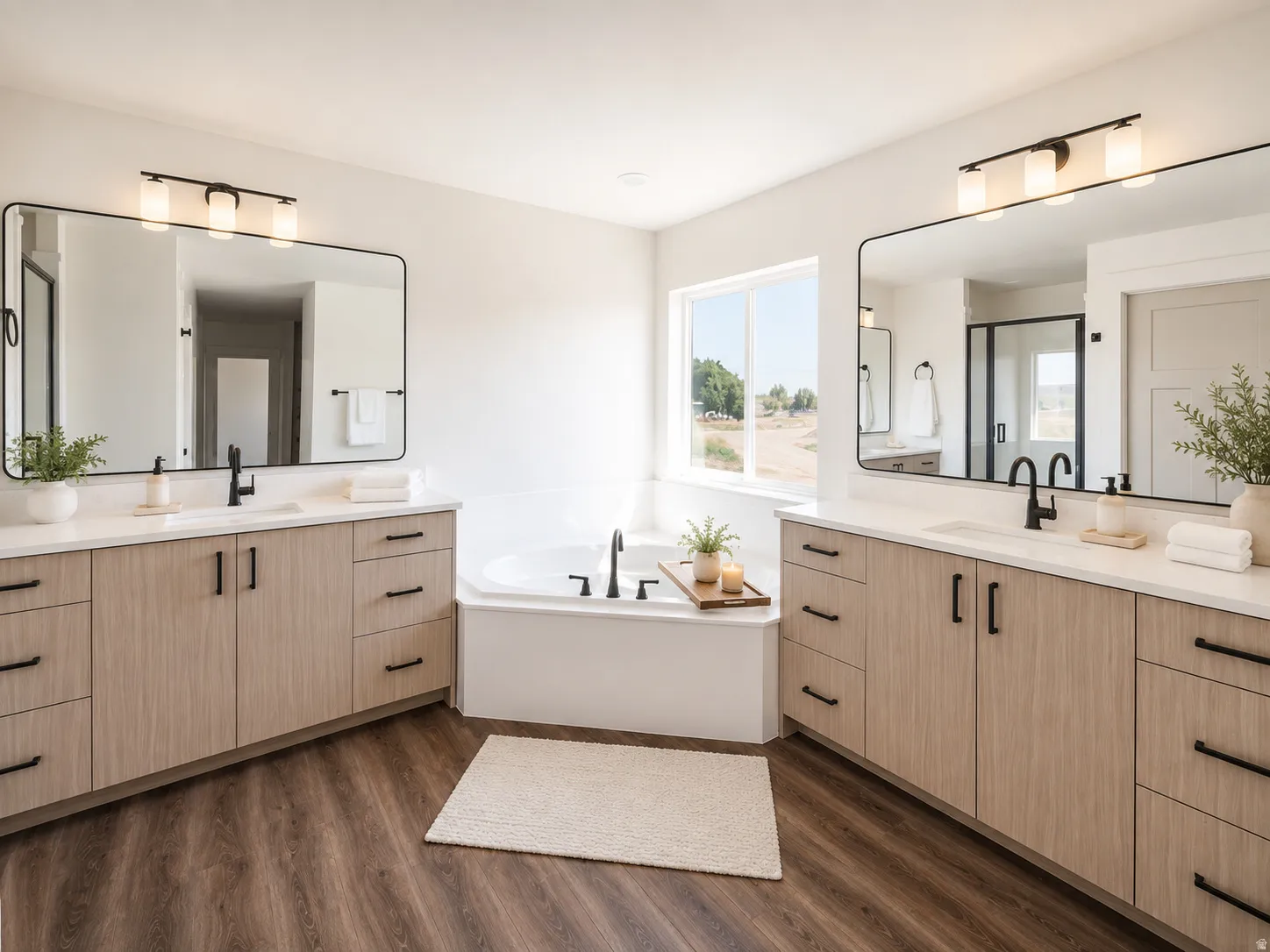 Dual vanities with white countertops, wood-finish cabinetry, and matte black hardware