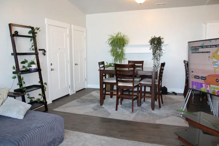 Open-concept living space with wood-finish flooring