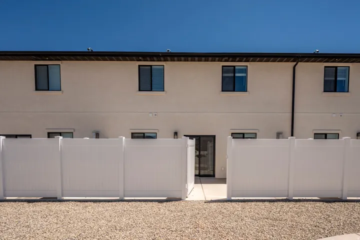 Stucco exterior with multiple windows