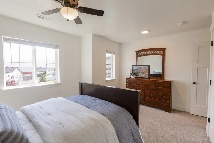 Recessed lighting, ceiling fan light fixture, carpeted flooring, and white paneled doors
