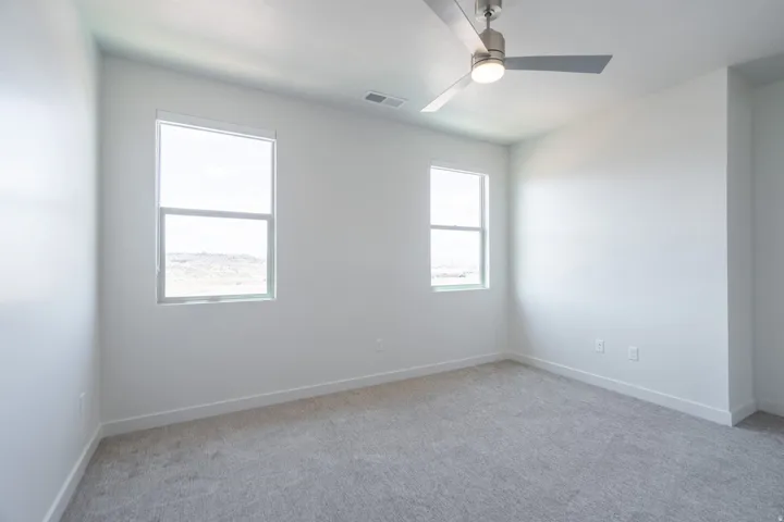 Neutral-toned carpeting paired with white walls