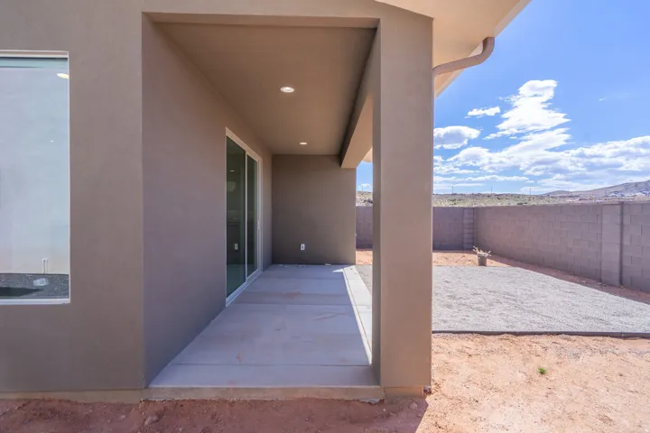 Covered patio with recessed lighting, concrete flooring, and sliding glass door access