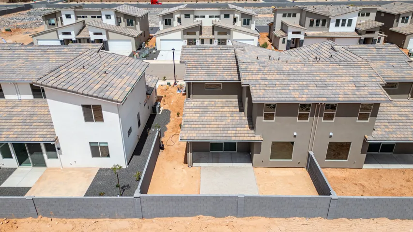 Contemporary residential properties featuring stucco exteriors and tile roofs