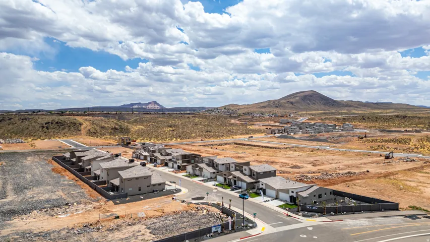 Newly constructed residential development featuring contemporary architecture, paved streets, and dedicated landscaping