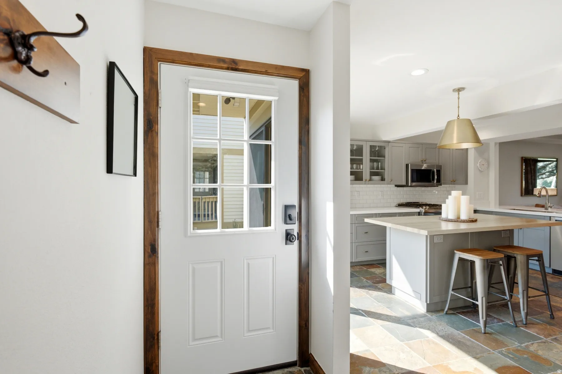 Entry door with wood-finish trim and glass paneling