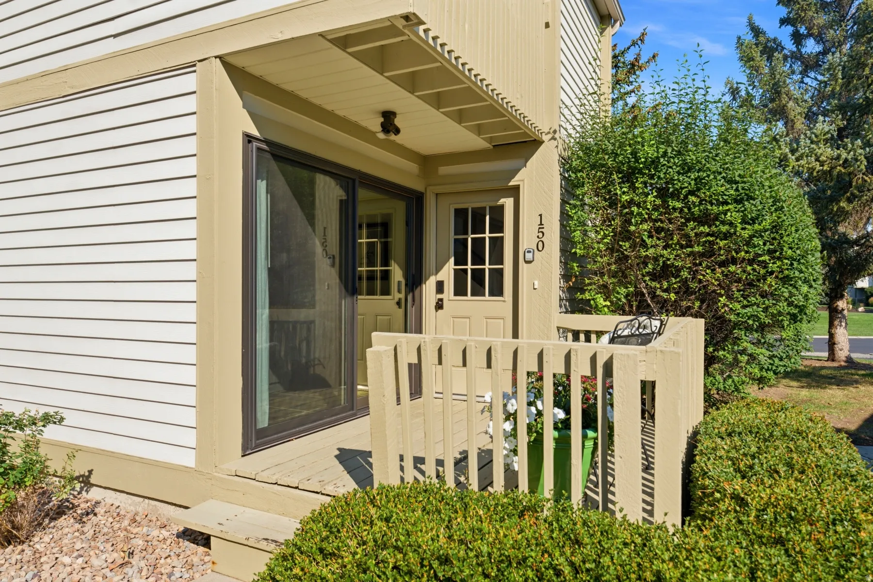 Entry patio featuring a sliding glass door and a paneled entry door