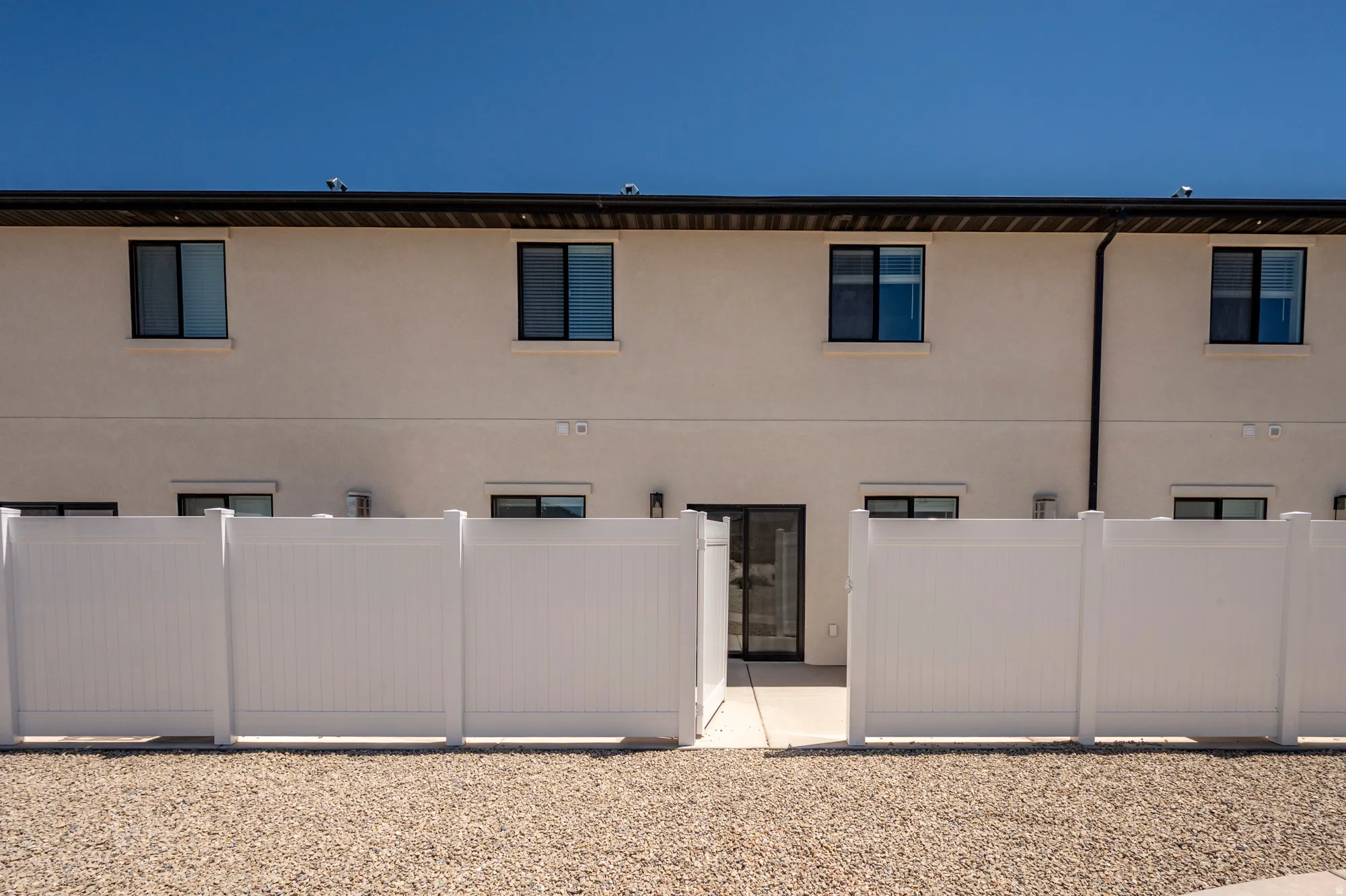 Stucco exterior with multiple windows