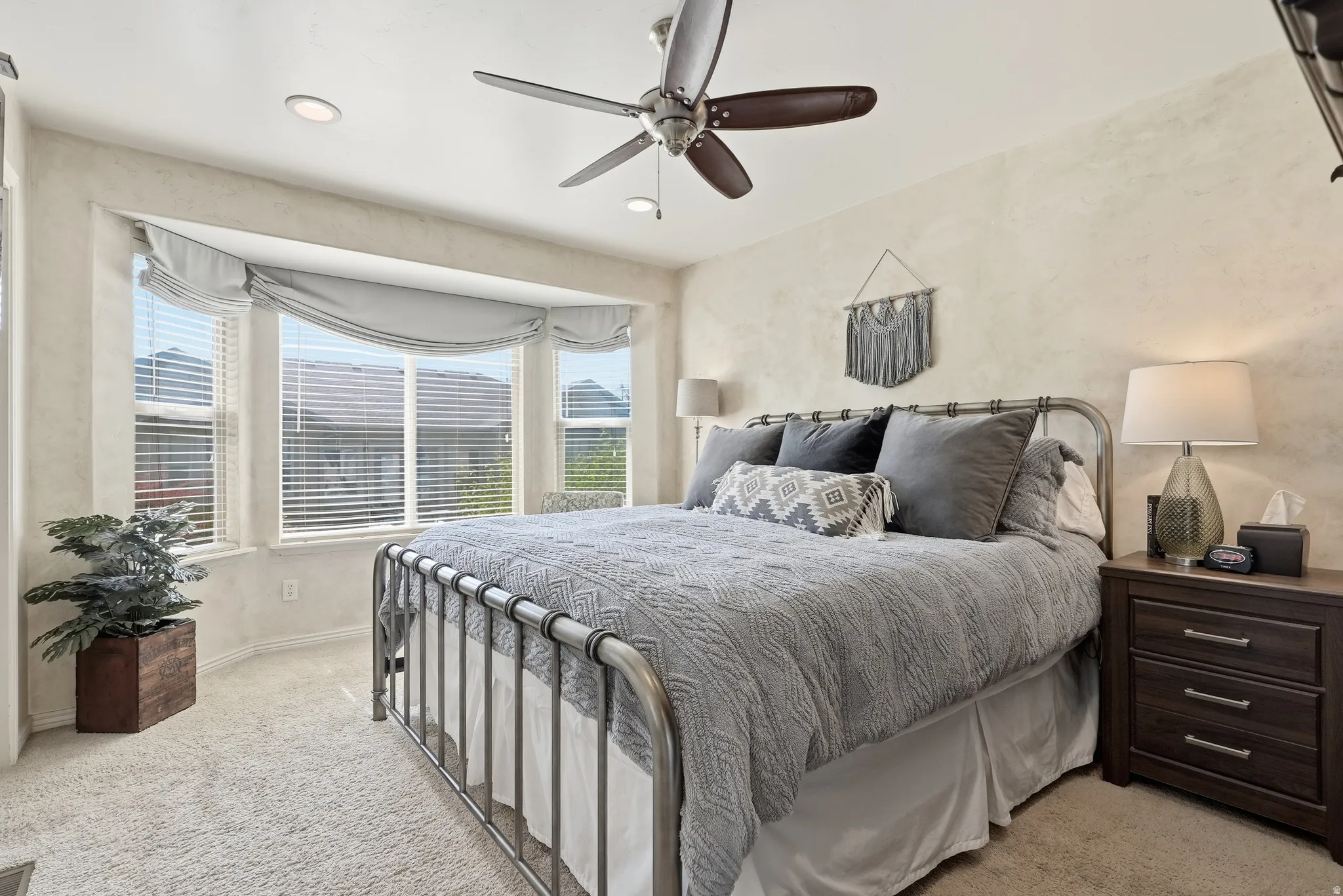 Recessed lighting and ceiling fan overhead