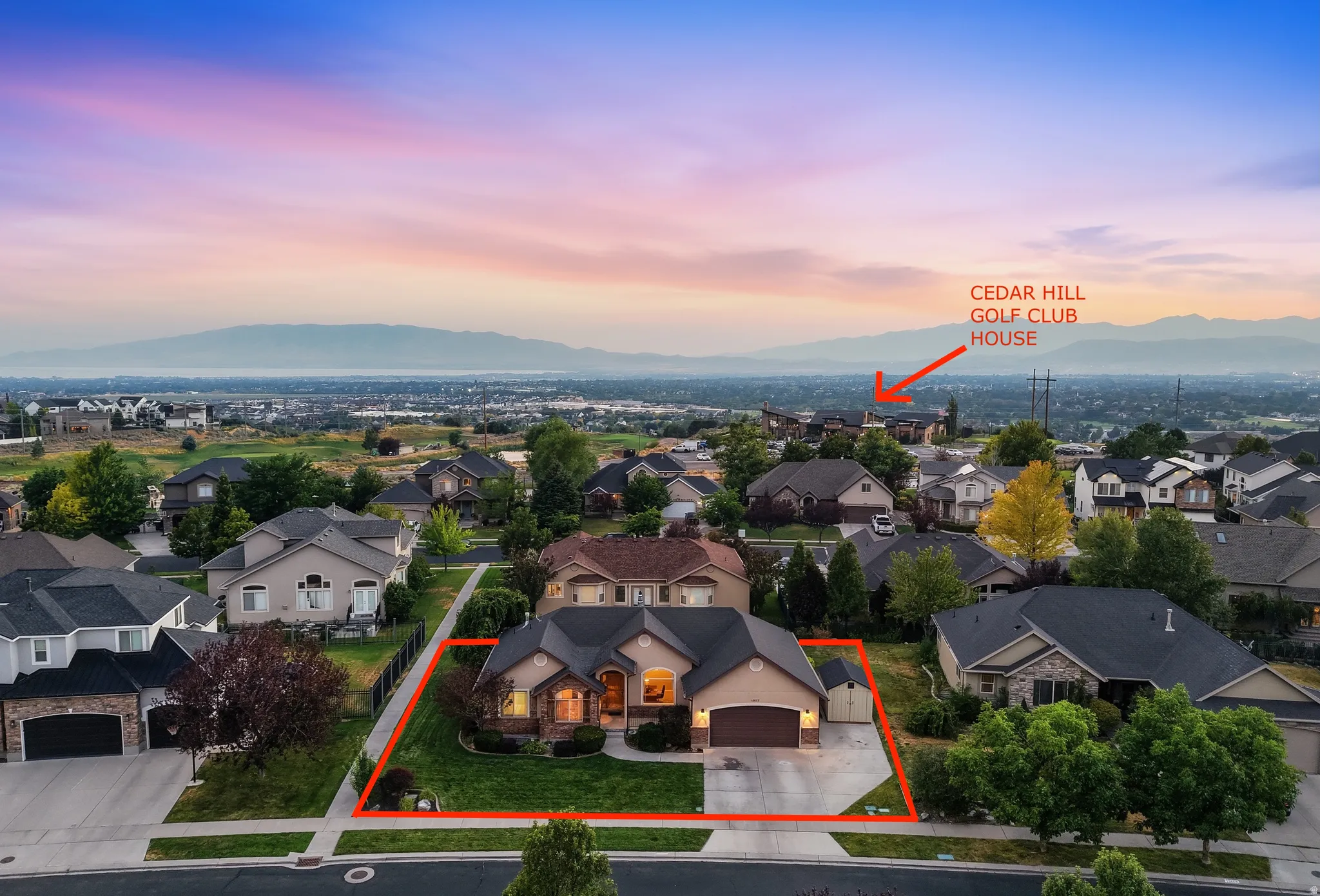 Single-story residence with an attached garage, landscaped front yard, and a concrete driveway