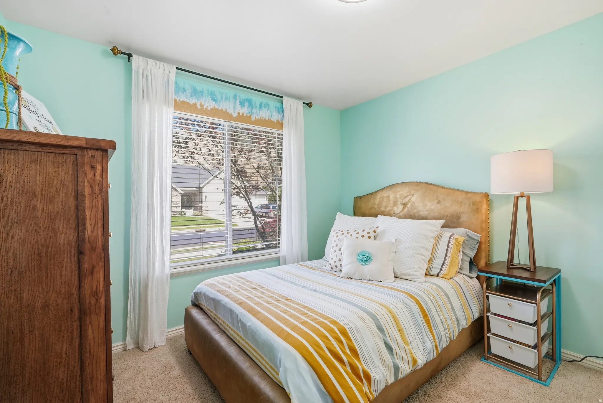 Recessed ceiling light, carpeted flooring, window with blinds, and light blue wall finish
