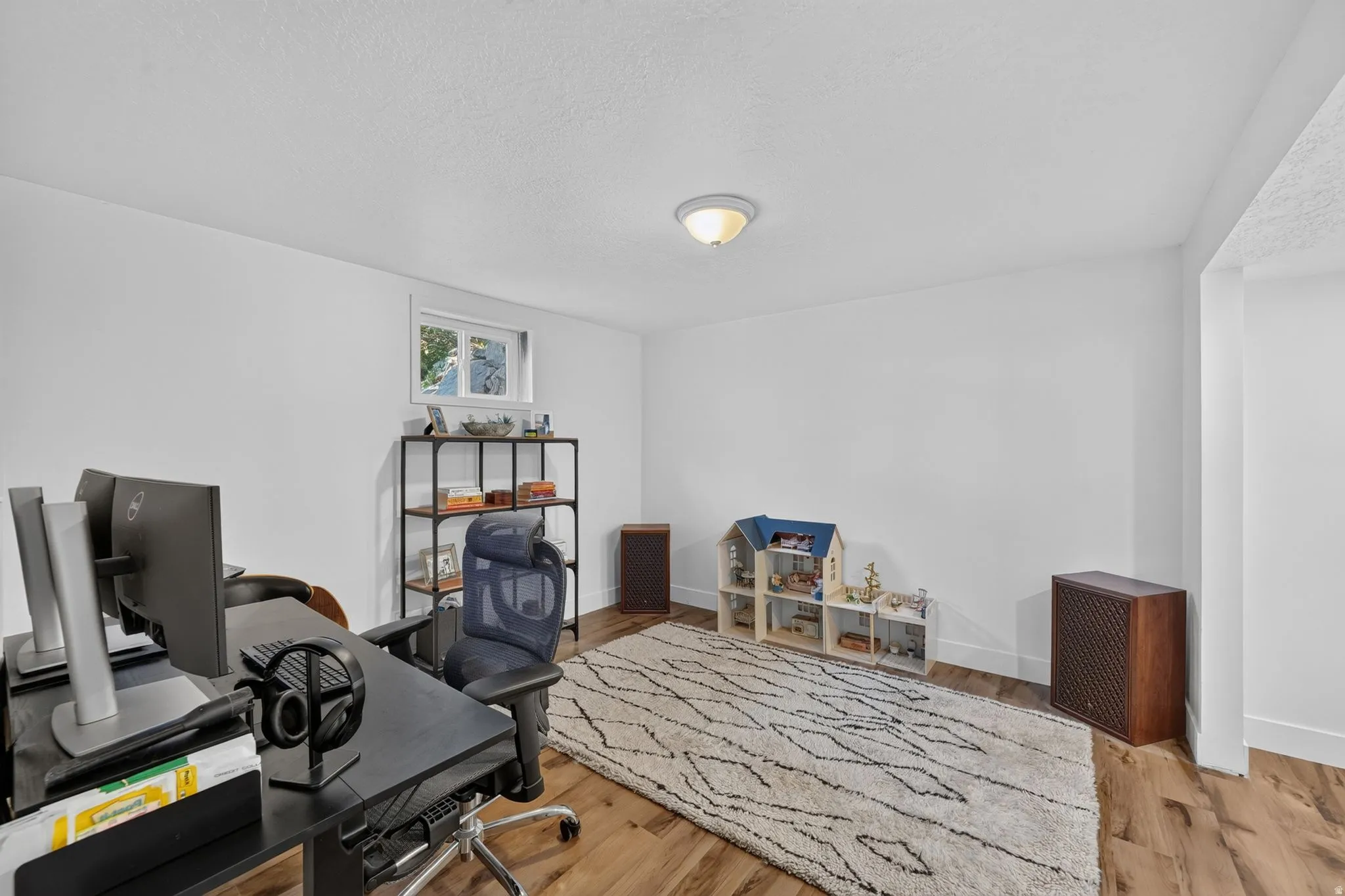 Versatile bonus room featuring hardwood flooring, recessed ceiling lighting, and ample square footage suitable for a home office, studio, or recreational space