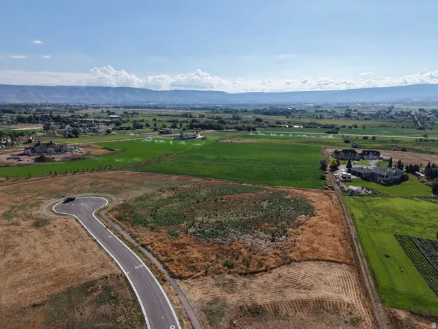 Paved cul-de-sac with surrounding undeveloped land