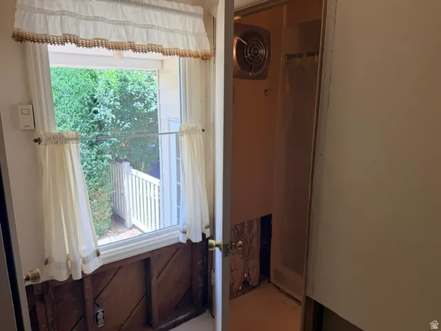 Utility room west facing window and entrance to the 3/4 bathroom.