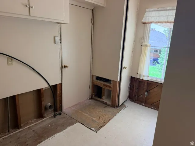 Utility room with the laundry hook-ups, adjoining 3/4 bath and access to the garage, kitchen, family room, upstairs bedroom/office and covered patio!