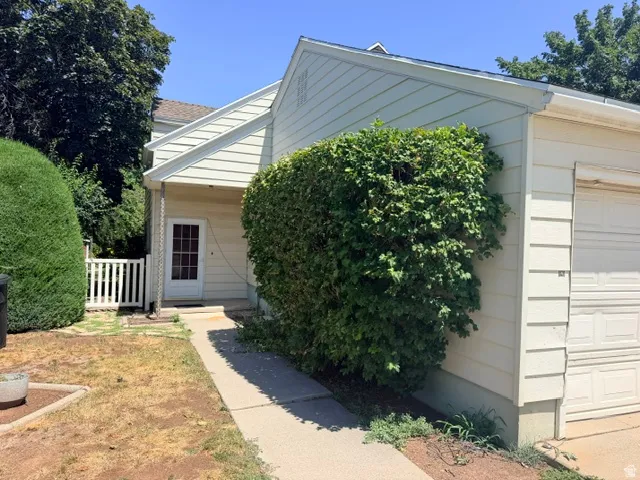 Walkway to enter the family room (no stairs) and gate to the backyard.