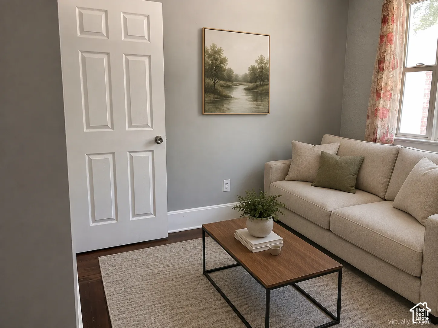 (Front Unit) Hardwood flooring with baseboard trim, and a window with natural light