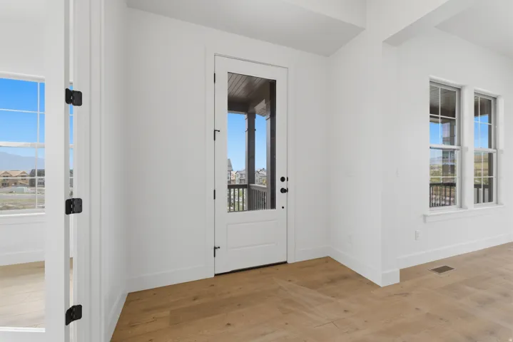 White walls with wood-finish flooring