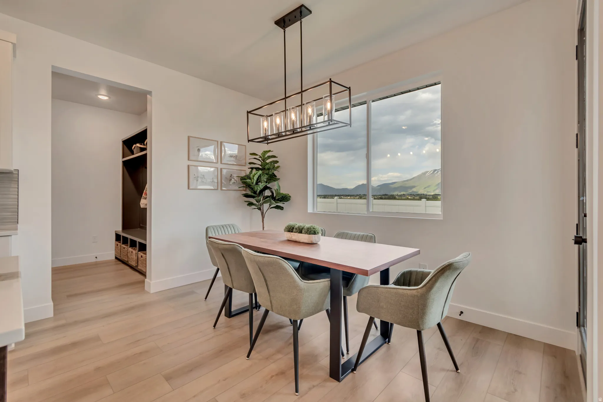 Dining area featuring wood-finish flooring and a rectangular window