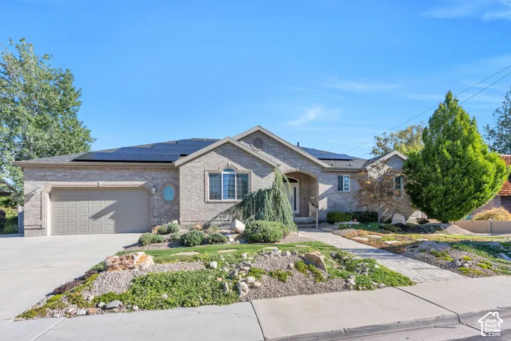 Brick and stucco exterior with an arched entry