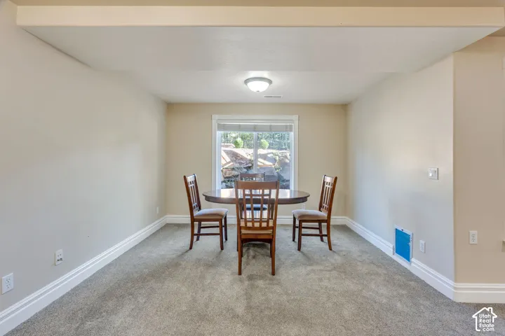Recessed ceiling light, neutral wall color, white trim, and a prominent window
