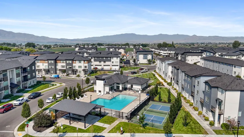 Outdoor swimming pool, covered outdoor seating area, tennis court, basketball court, and structured landscaping
