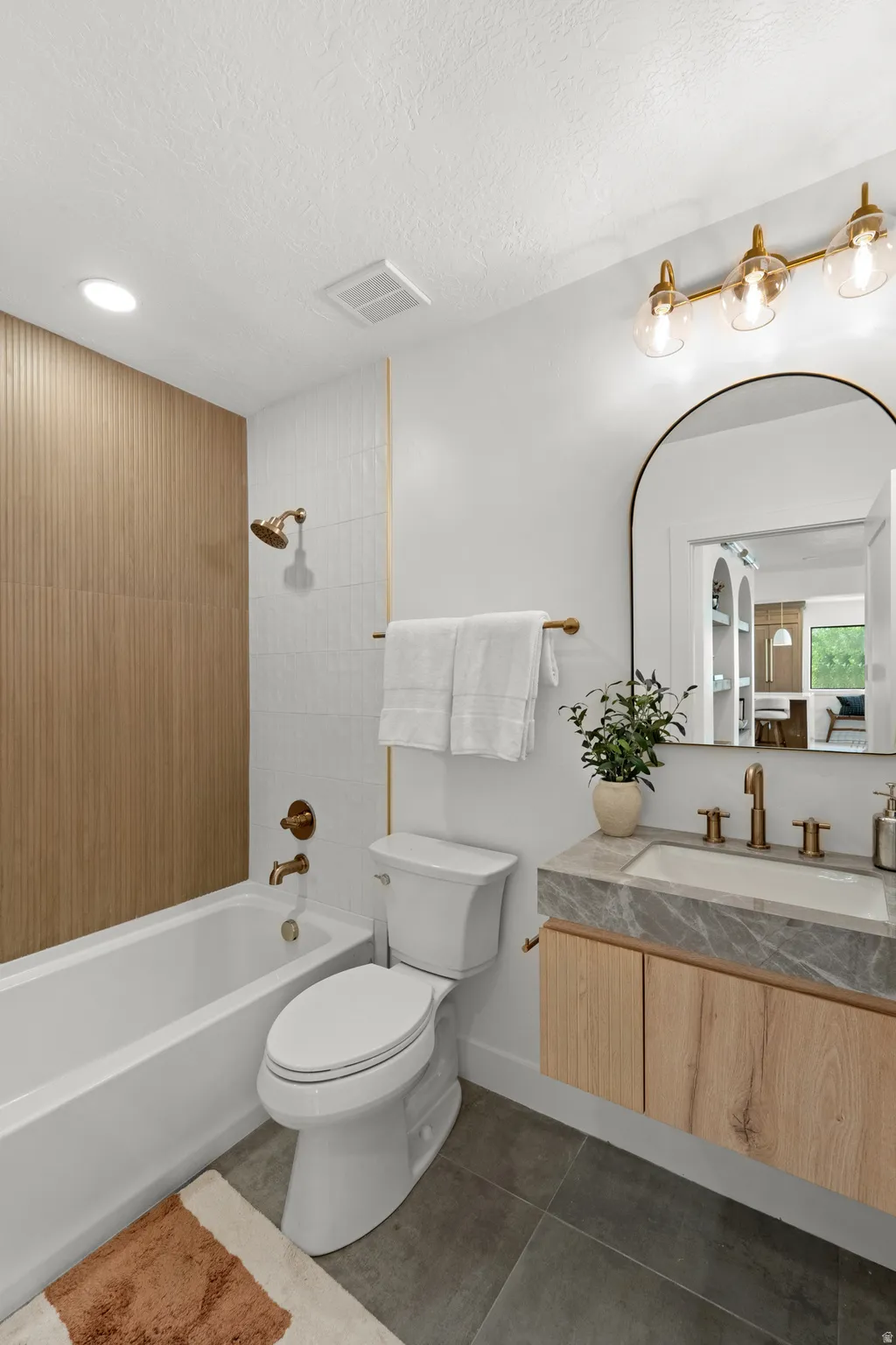 Textured wood-finish accent wall in shower
