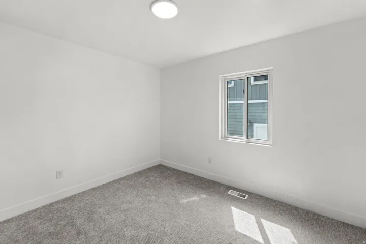 Bright interior with light gray carpeting and white walls