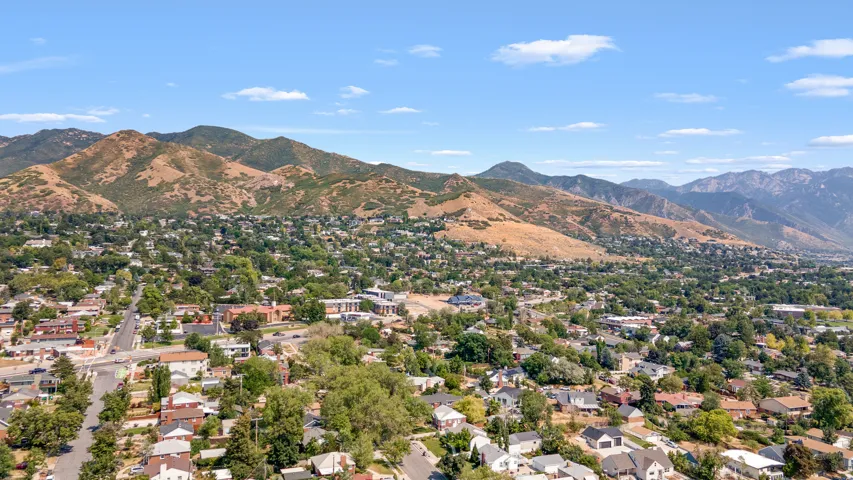 Expansive mountain backdrop with a residential area