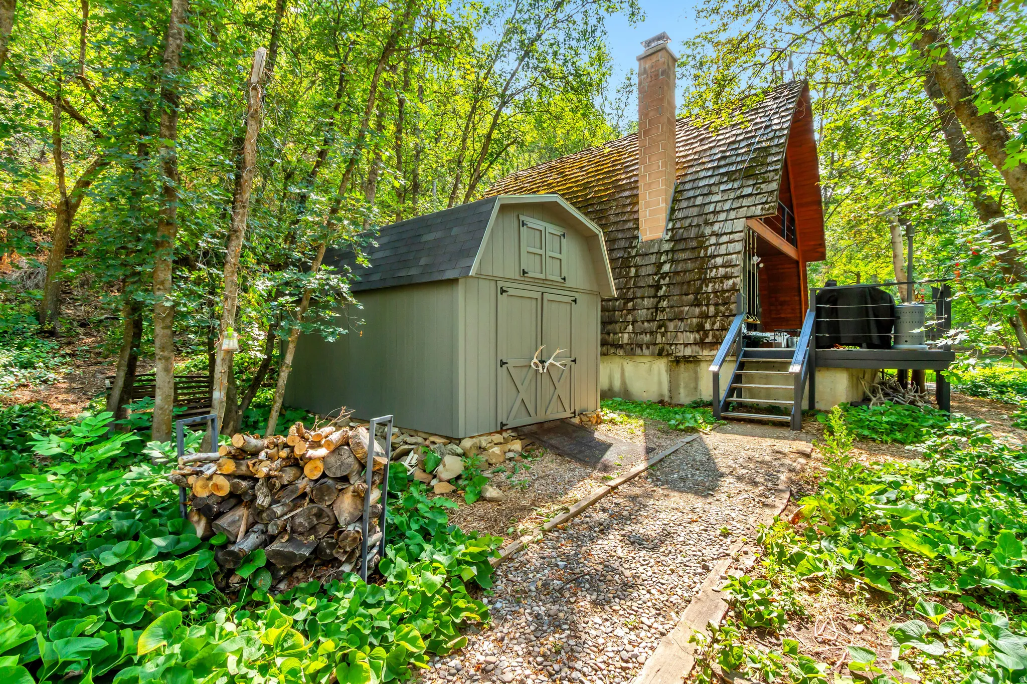 10 X 16 foot shed (another open shed on the other side of the home)