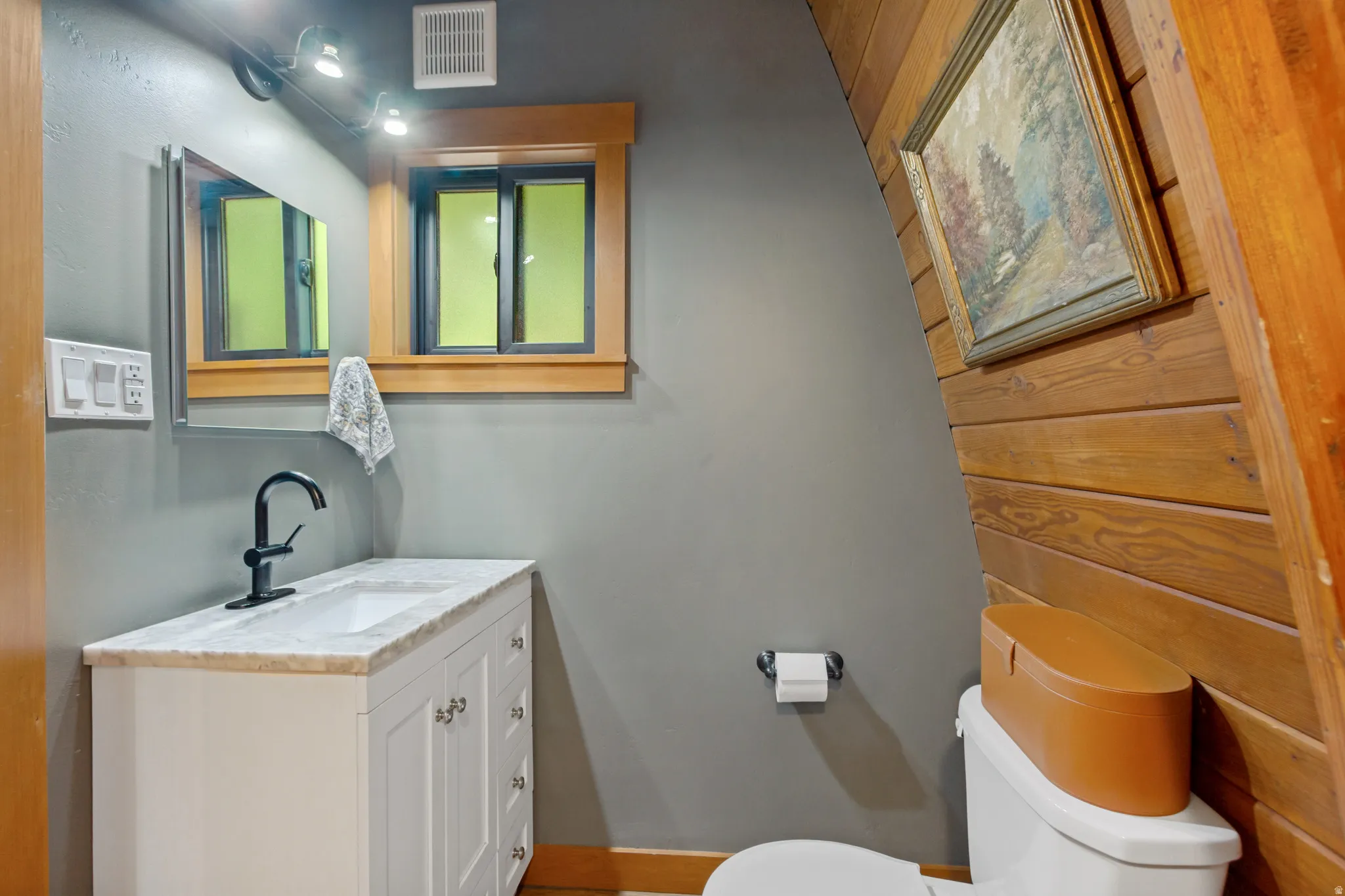 Updated bath with tile and stone shower