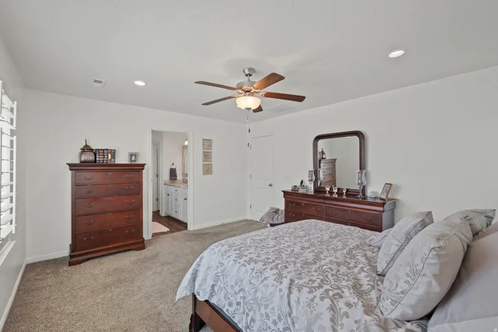 Spacious room with plush carpeting, ceiling fan with integrated lighting, and recessed ceiling lights