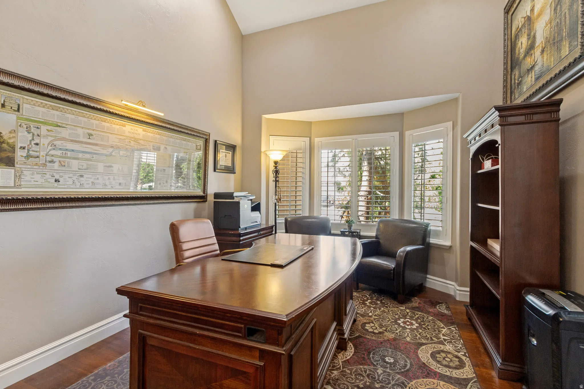 Hardwood flooring, bay windows, high ceilings, plantation shutters, and a built-in bookcase