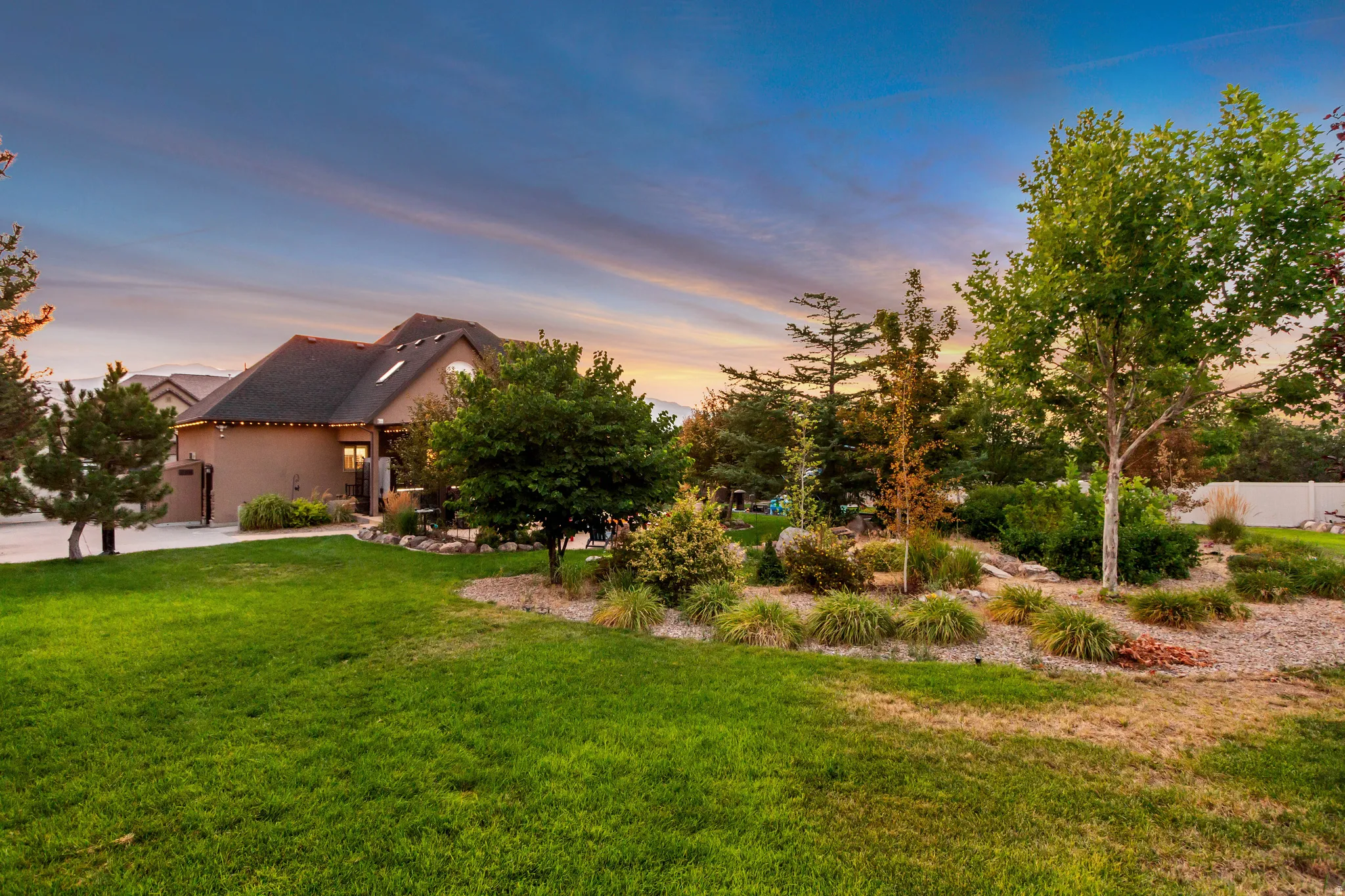 Spacious lawn with established landscaping and mature trees